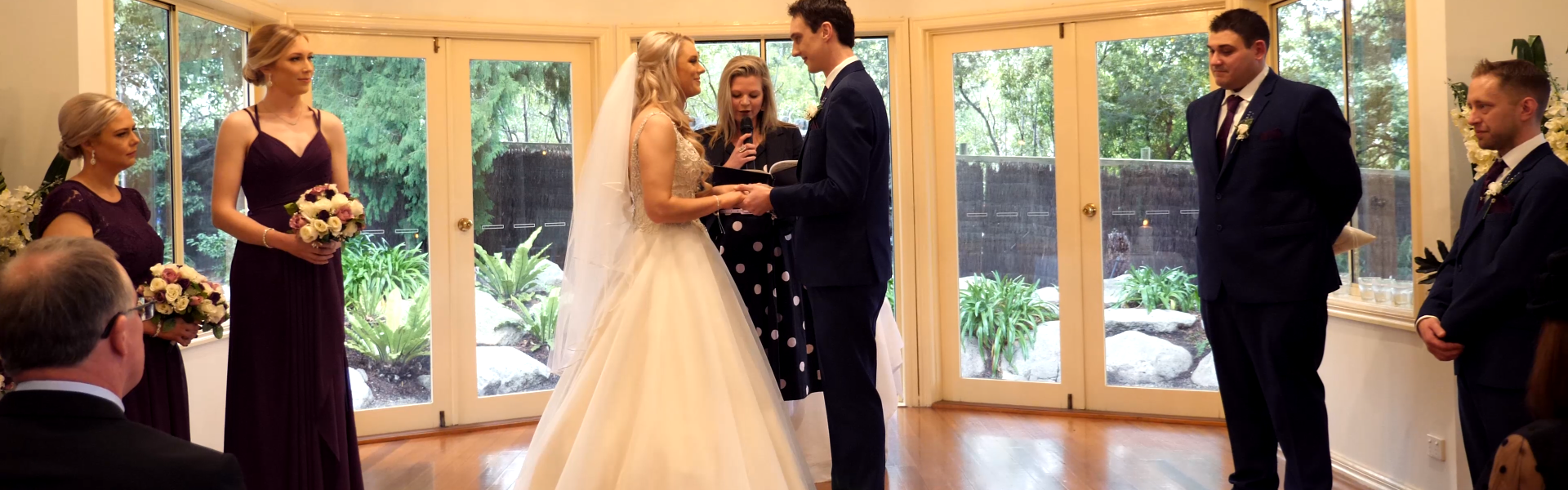 87470816-c365-4893-a91a-7a78bdb0cafc-Erin and James ceremony wide.png