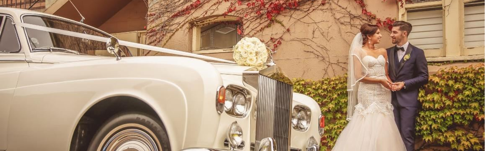 The Newlyweds By Their Bridal Car