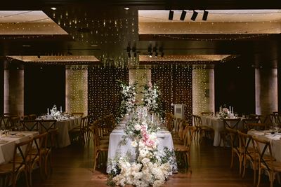 Wedding flowers, wooden wedding venue, fairy lights